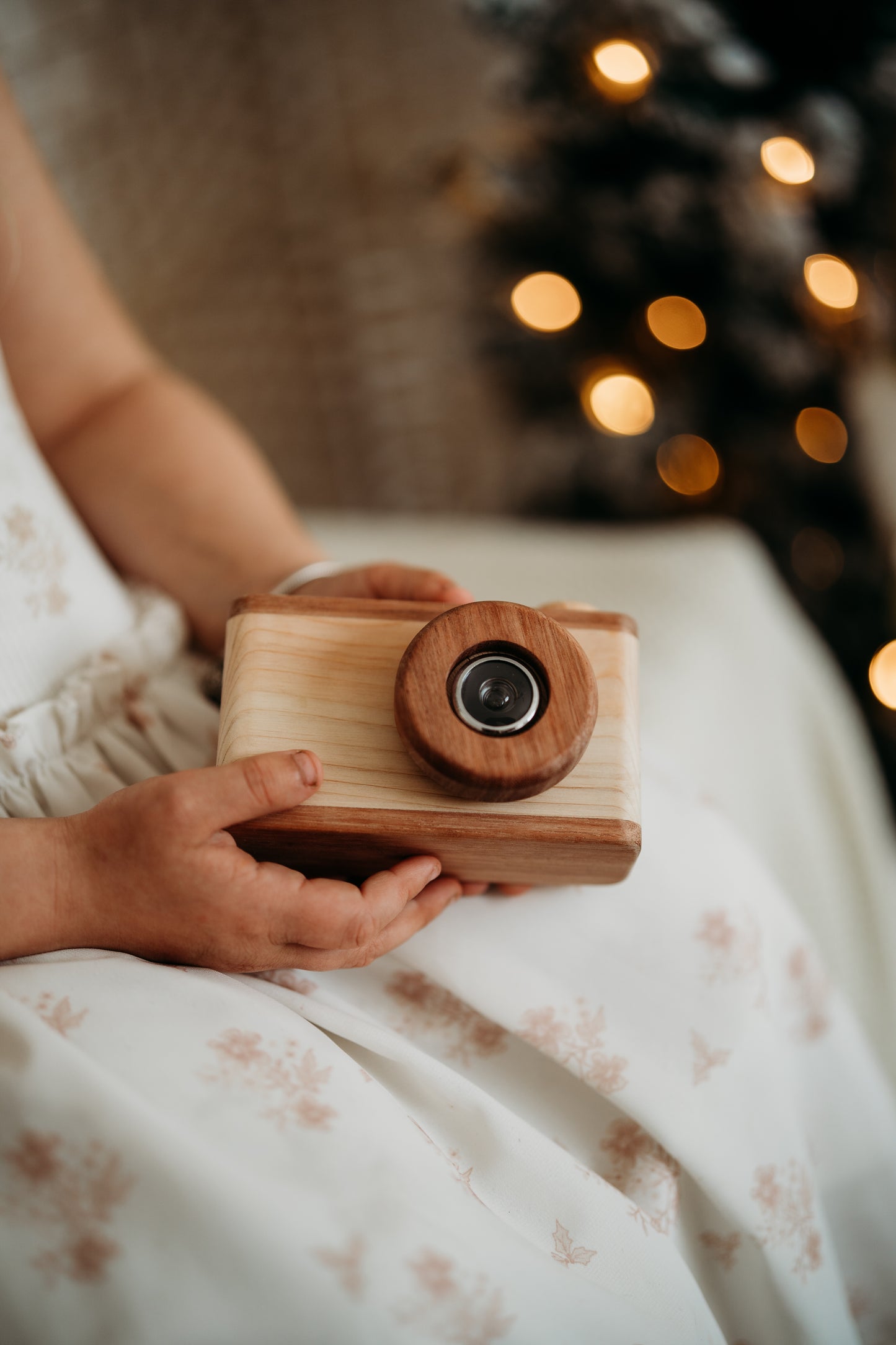 Child hands holding little camera